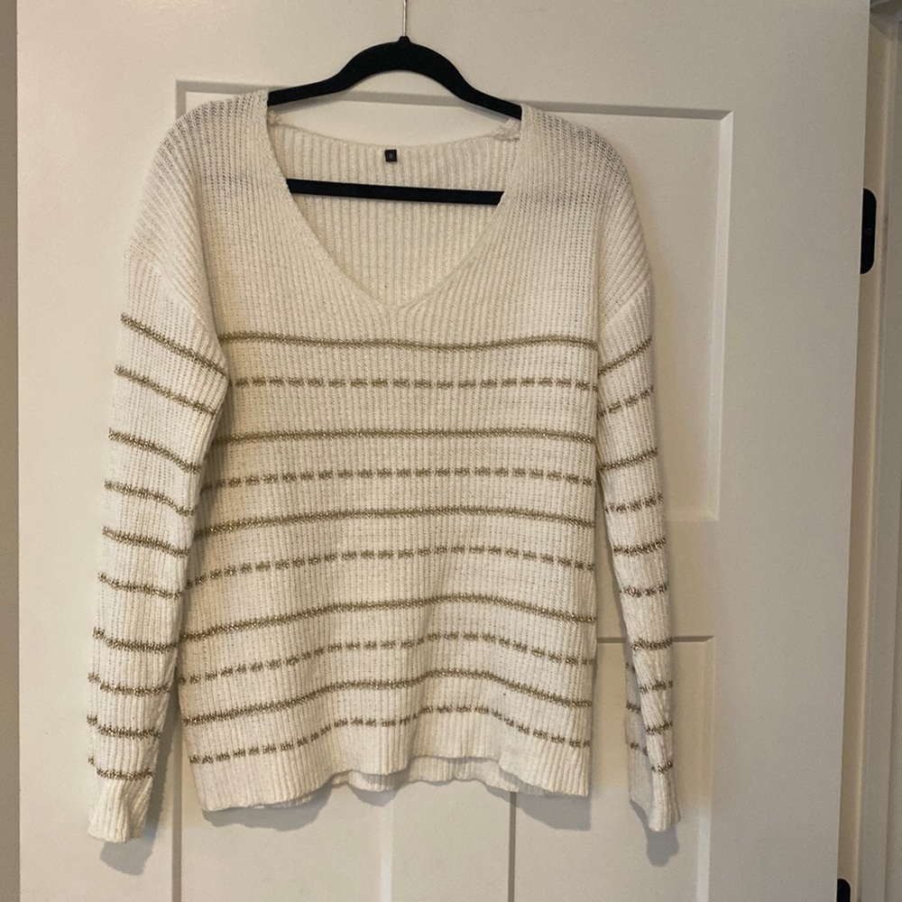White with gold sweater